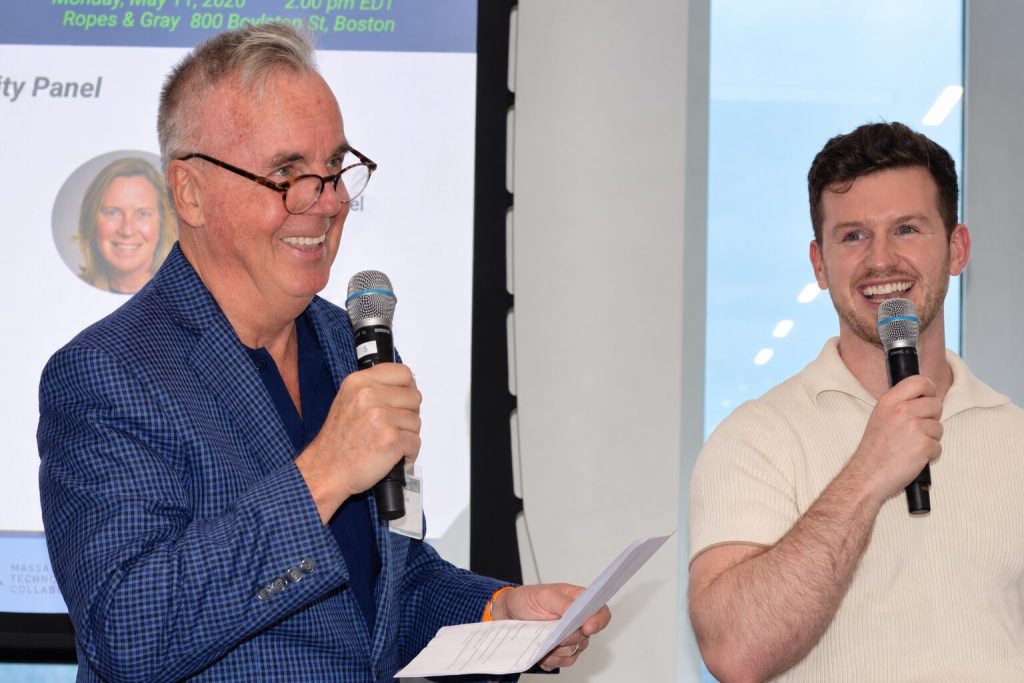 Jim Knox and a guest speaker on stage at a BBA panel