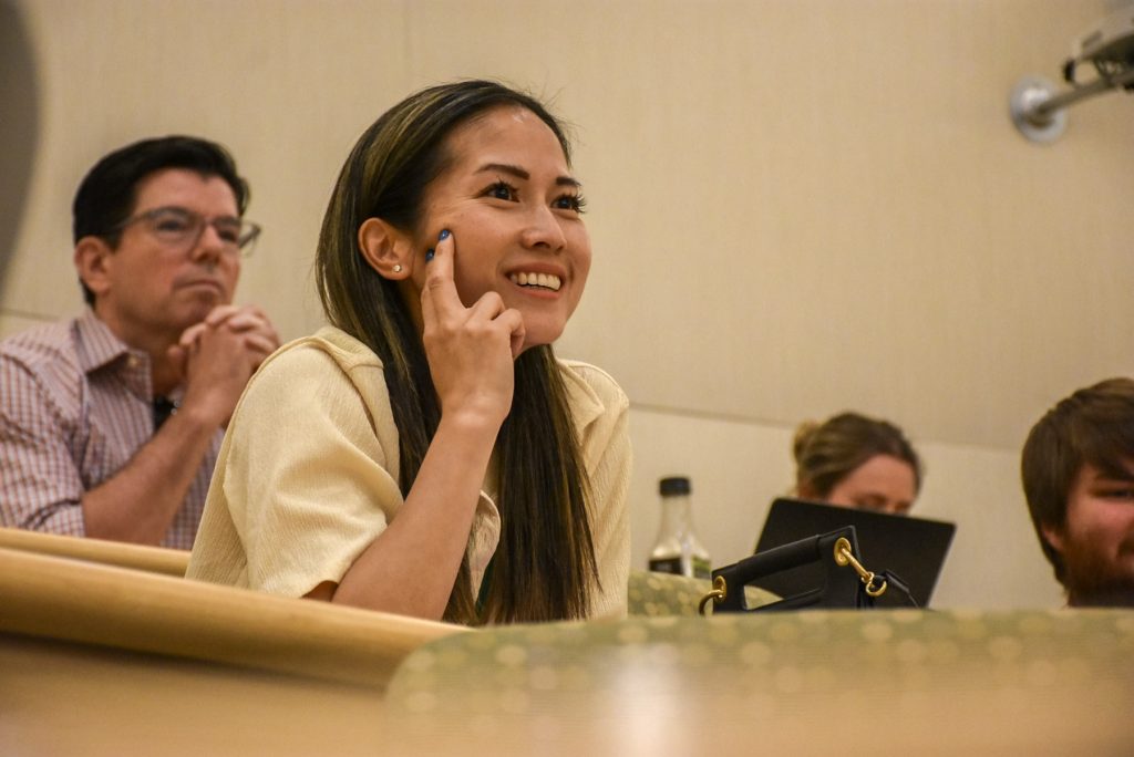 Attendee smiling during a BBA panel