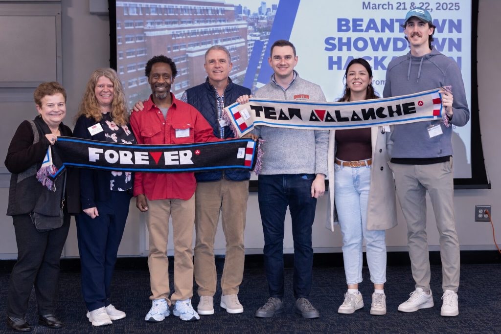 Avalanche team members holding scarves at a BBA event