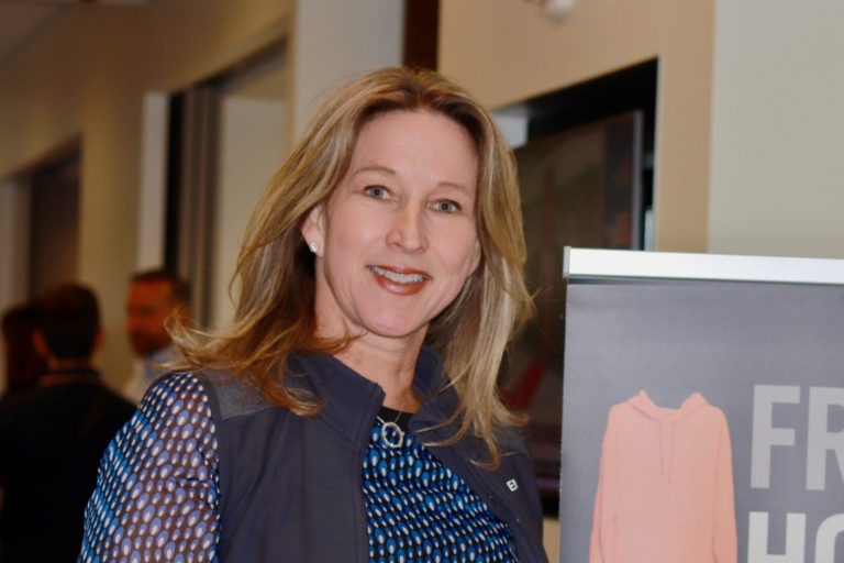 Annelise O. holding her book at a BBA book signing
